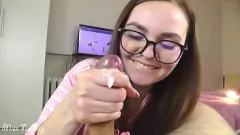 Play Glasses Wearing Teen Swallows a Massive Cumshot After Intense Blowjob and Handjob Session